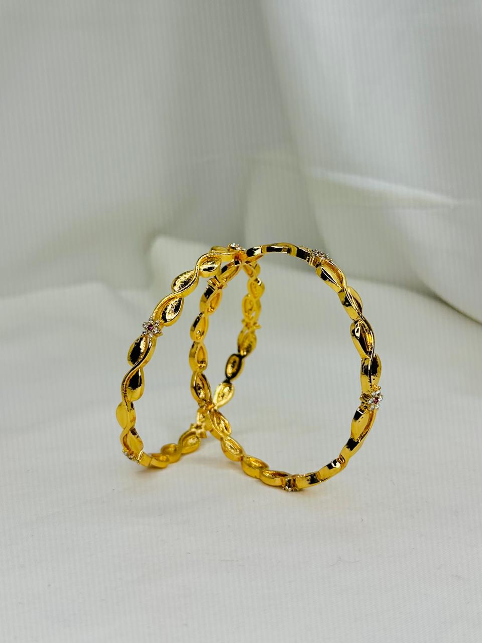 Golden Leaf Twist Bangles – Elegant Crystal Accent Set