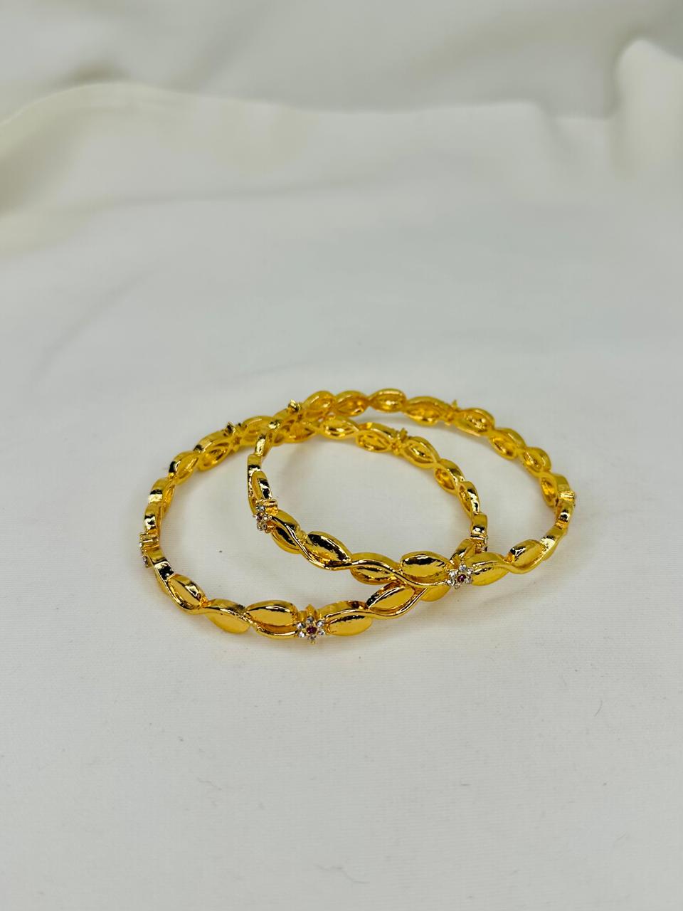 Golden Leaf Twist Bangles – Elegant Crystal Accent Set