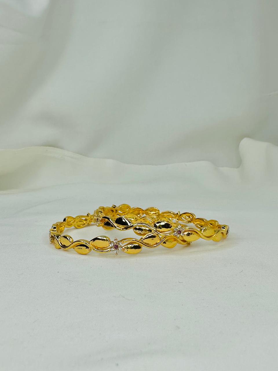 Golden Leaf Twist Bangles – Elegant Crystal Accent Set